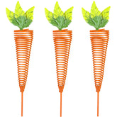 ABELOTS Easter iron carrot stakes add festive color to outdoor garden beds.