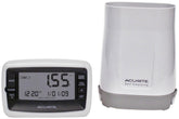 AcuRite wireless rain gauge with self-emptying collector monitors garden rainfall.