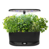 AeroGarden Bounty Basic front view on a kitchen counter showcasing compact indoor design for small spaces