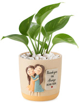 Afigurna 3D pot with two women hugging, a thoughtful garden gift.