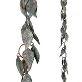 Aifeorzo rain chain with verdigris leaves decorates exterior.