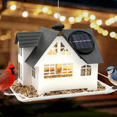 AIKS solar bird feeder glowing at dusk enhances garden ambiance while feeding backyard birds.