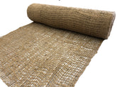 AK TRADING CO. Jute erosion control blanket on slope to prevent erosion.