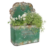 All Chic metal wall planter front view showcases green rustic finish for outdoor decor