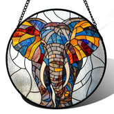 AMDERVEN stained glass elephant suncatcher creates rainbow light across windows.