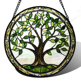 AMDERVEN stained glass window hanging with brown tree trunk brightens sunlit windows.