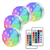AquaMiracle submersible LED light with remote for versatile underwater illumination.
