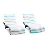 Arkwright striped lounge cover with pocket keeps towels in place on chairs.