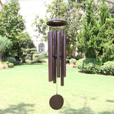 ASTARIN 45-inch wind chimes hanging in bronze finish in a garden scene