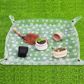 Azureblue repotting mat folded compact for portable indoor gardening.