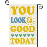 Baccessor You Look Good Today garden flag front view in burlap welcoming guests outdoors