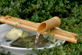 Bamboo Accents 18-inch three-arm spout fountain for serene garden water sounds.