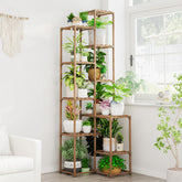Bamworld 72-inch tall plant shelf in a corner supports multiple pots.