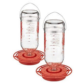Best-1 glass hummingbird feeder pair in garden attracts nectar-loving birds