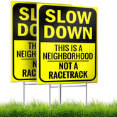 Bigtime Slow Down Sign dual-sided display enhances driver awareness near homes.