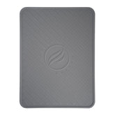BLACKSTONE spatula mat on grill shelf catching drips and protecting surfaces.