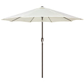 Blissun 9ft outdoor umbrella in creamy white fabric shading a sunny patio with seating.