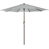 Blissun 9ft outdoor umbrella shading a backyard table in grey.