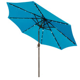 Blissun 9ft solar umbrella with LED lighting illuminates outdoor seating at dusk.