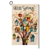 BLKWHT Spring Bird Garden Flag 12x18 fluttering in a sunny garden.