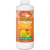 Bloom City Citrus & Fruit Fertilizer bottle being poured to nourish citrus trees.