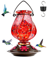 BOLITE hummingbird feeder with hand-blown red glass, a striking outdoor focal point.