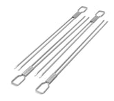 Broil King 12-inch dual-prong skewers on grill for stable turning.