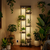 Bstrip plant stand with seven tiers displaying lush indoor foliage and organized space