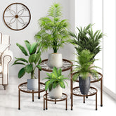 CADANI 5-pack metal plant stands for indoor and outdoor use, ideal for organizing pots.