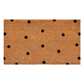 Calloway Mills black polka-dots doormat with coarse coir for dirt scraping at the entry.