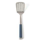 Calphalon Edge slotted turner in navy blue with perforations for draining liquids.