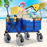 CAtArt Beach Wagon with big wheels glides smoothly on sand for easy transport.