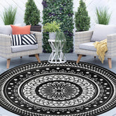 Cekene round outdoor rug on patio for durable outdoor entertaining.