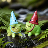 Charming resin frog figurine with hat close-up for fairy garden details.