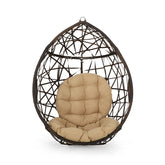 Christopher Knight Home Isaiah teardrop hanging chair in cozy indoor-outdoor setting.