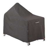 Classic Accessories Ravenna 60in Kamado cover shields a ceramic grill from rain.