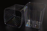Clear Plastic Liner inside a 5in square planter provides moisture containment.