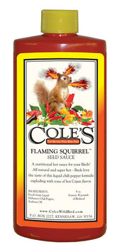 Cole's Flaming Squirrel Seed Sauce bottle poured to attract backyard birds