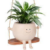 CONNOVA smiley face flower pot hanging for playful indoor decor.
