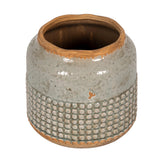 Creative Co-Op round terra-cotta hobnail planter vase with distressed finish adds rustic charm.