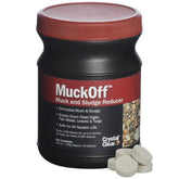 CrystalClear MuckOff tablets dissolving in pond water to reduce muck and improve clarity.