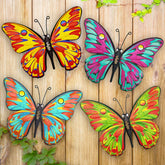 Daogtc four-pack metal butterflies on a sunlit garden fence for outdoor charm