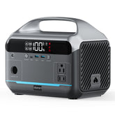 DaranEner portable power station with dual 600W outlets powering a laptop outdoors.