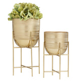 Deco 79 gold metal planter set, front view, elevating modern interiors.