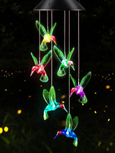 DesGully solar LED hummingbird wind chime on patio adds color and charm.