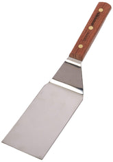 Dexter-Russell traditional hamburger turner blade delivering precise flips on a hot grill.