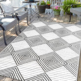 DiiKoo waterproof outdoor rug 5x8ft front view shows dual reversible patterns for versatile spaces