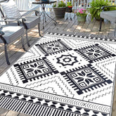 DiiKoo waterproof outdoor rug 5x8ft with reversible pattern for patios and RV adventures.