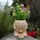Dolkgy cute head planter on a windowsill adds playful indoor decor.