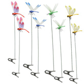 Draduo red dragonfly clip enhances outdoor decor with bright garden color.